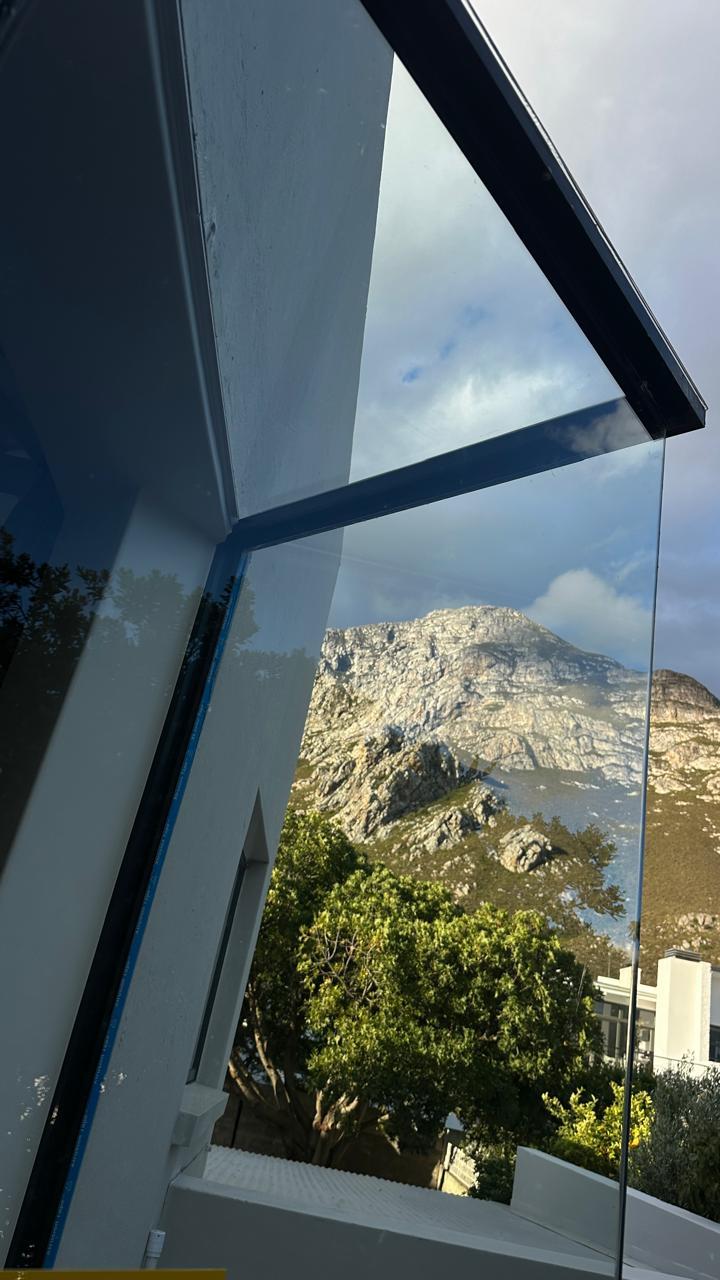 Clean window glass with a clear view of the mountain outside